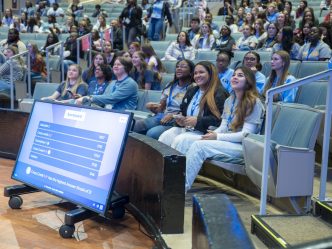 A group of students in a theater.