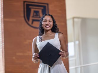 Woman hold a graduation cap