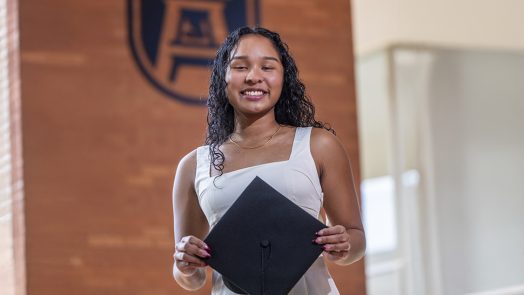 Woman hold a graduation cap