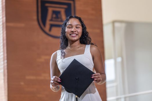 Woman hold a graduation cap