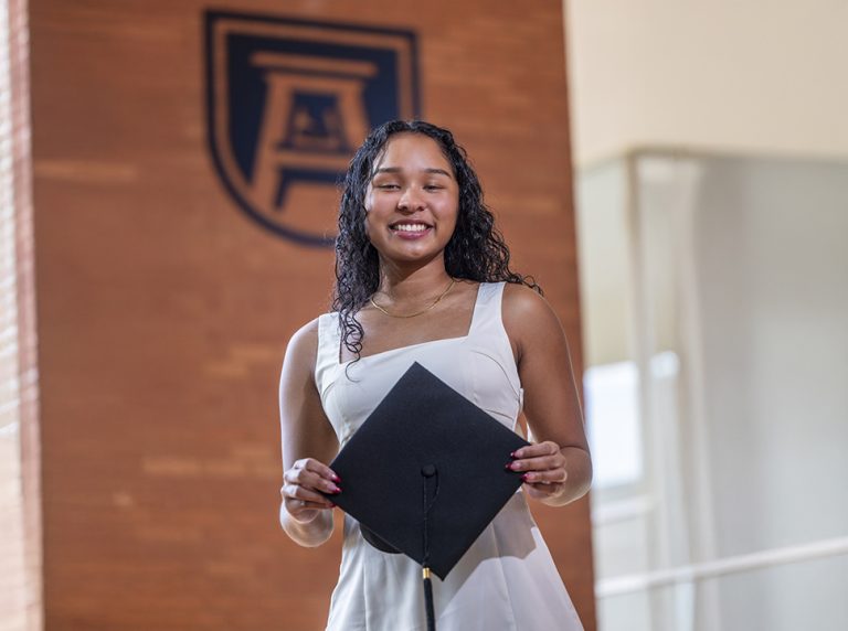 Woman hold a graduation cap
