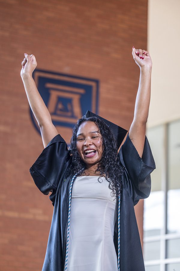 Woman with her arms raised