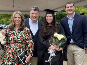 Man standing with his family