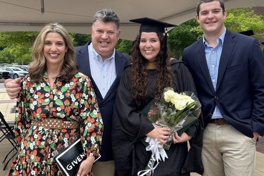 Man standing with his family