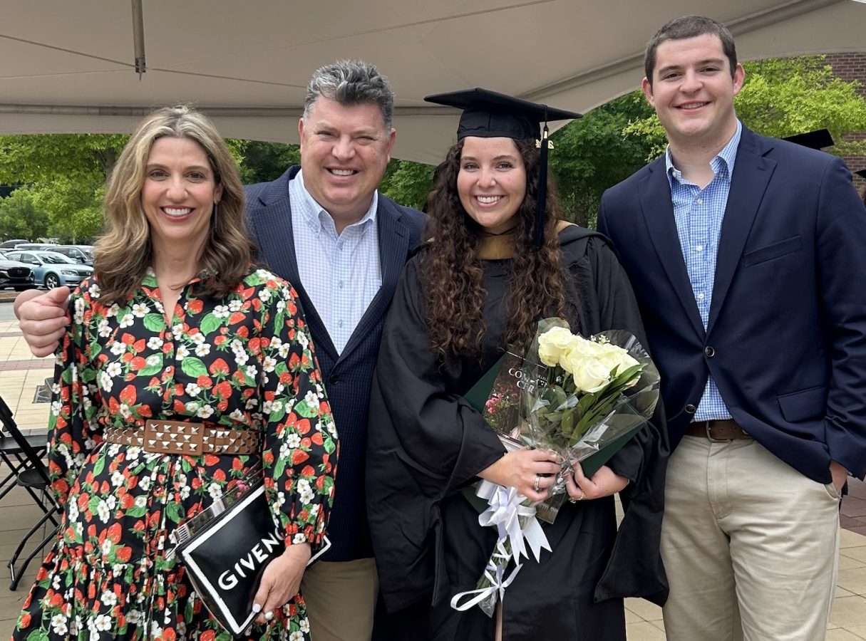 Man standing with his family