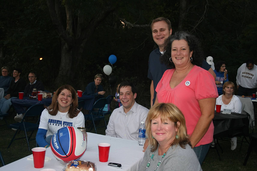 Men and women smiling