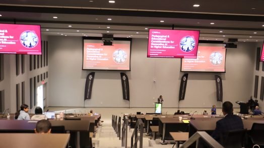 A large classroom in a modern building on a college campus.