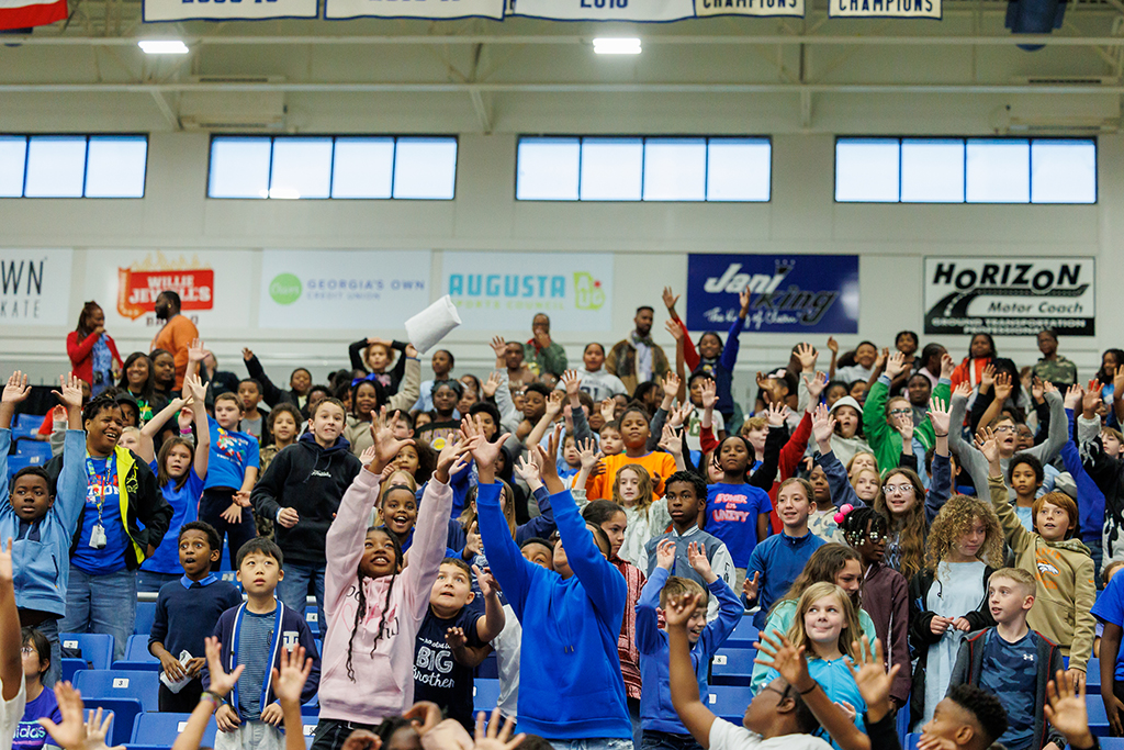 Boys and girls trying to catch a T-shirt