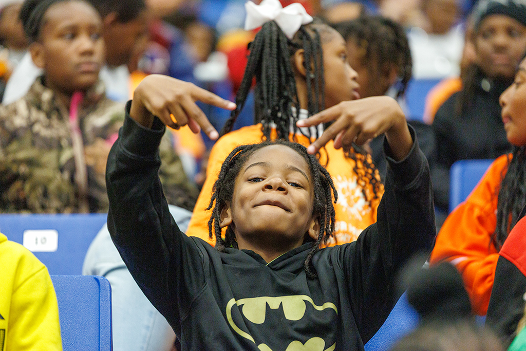 A young boy posing for photos