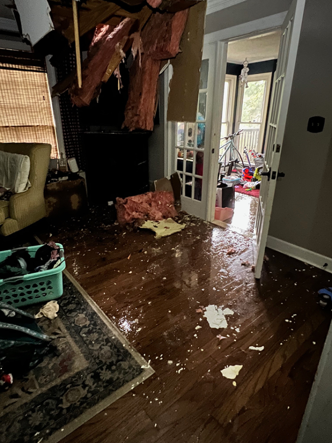 Damage to the interior of a home, insulation falling out of the ceiling.