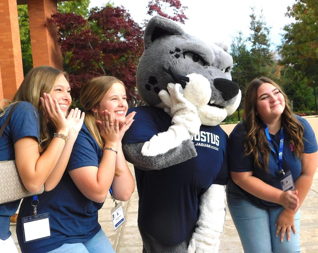 Students taking a photo with Augustus