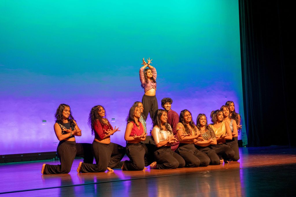 A group of women on stage dancing