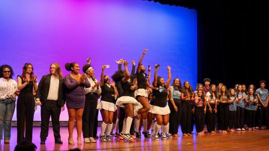 Unity Talent and Art Show contestants lined up on the stage at the Grover C. Maxwell Performing Arts Theatre.