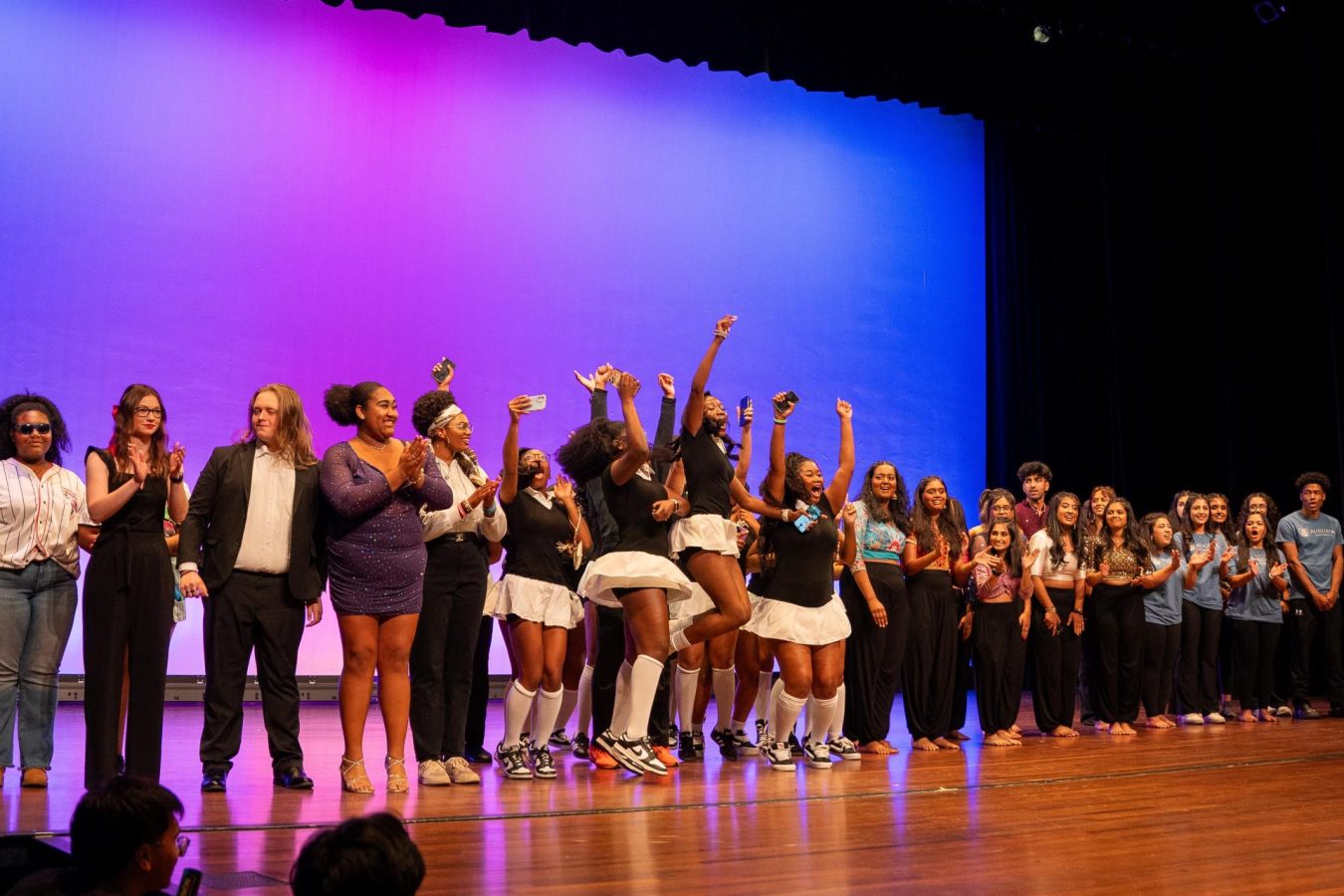 Unity Talent and Art Show contestants lined up on the stage at the Grover C. Maxwell Performing Arts Theatre.
