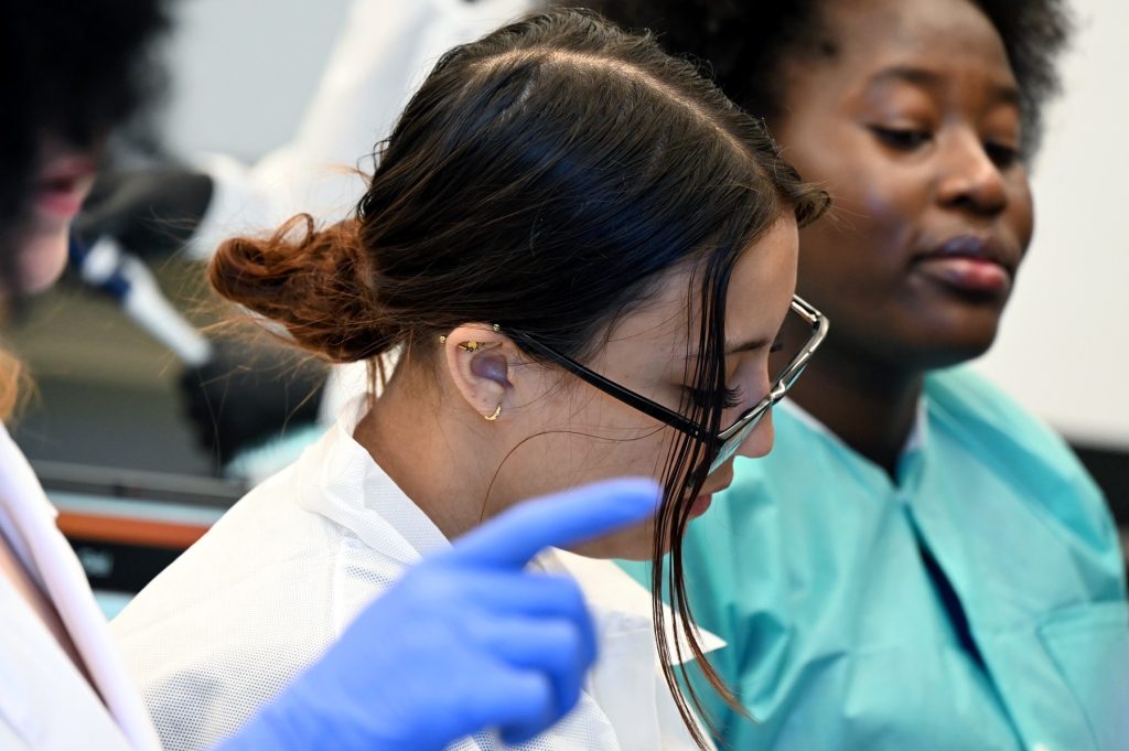 A photo of a student working in a laboratory at the Georgia Cancer Center.