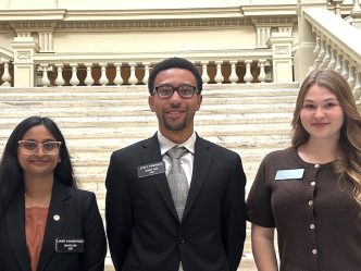 Three students in the Capitol.