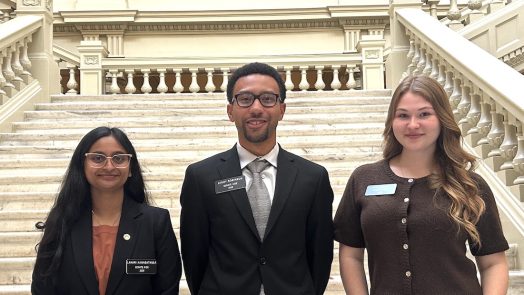 Three students in the Capitol.