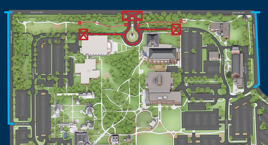 An overhead view of a college campus complete with roads around and through campus, and academic buildings.