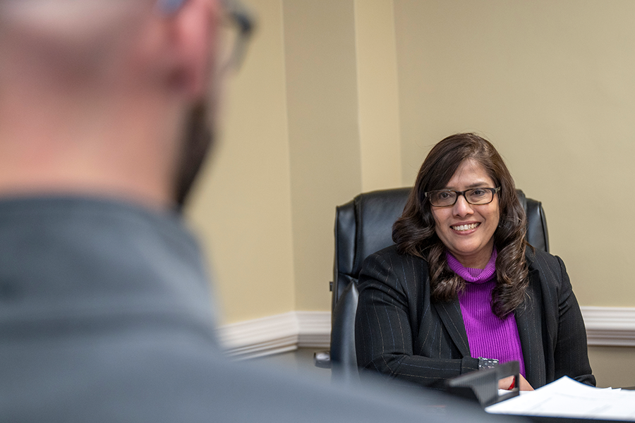 A female doctor speaks with a male patient.