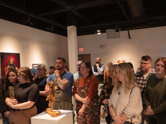 A crowd of people in a gallery