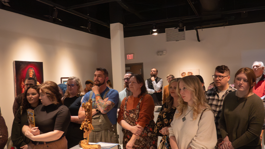 A crowd of people in a gallery