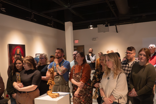 A crowd of people in a gallery