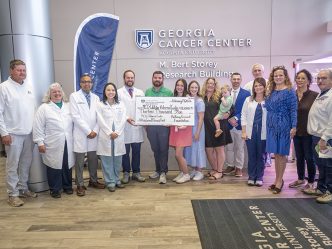 Physicians and others at check presentation