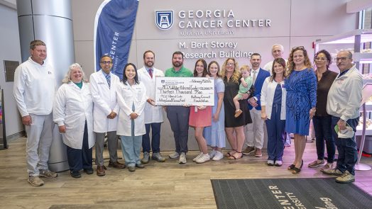 Physicians and others at check presentation