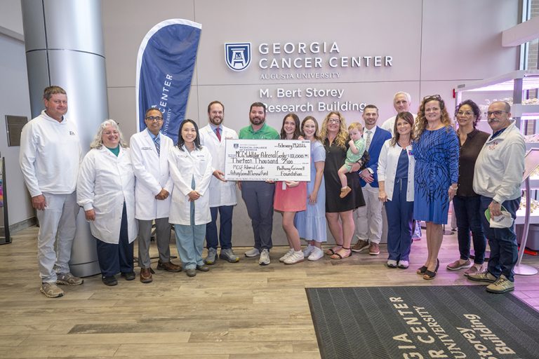 Physicians and others at check presentation