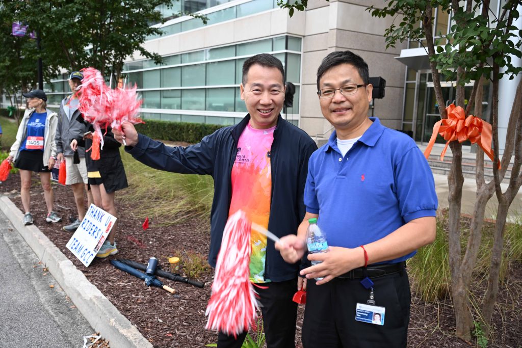 Two men smiling at camera
