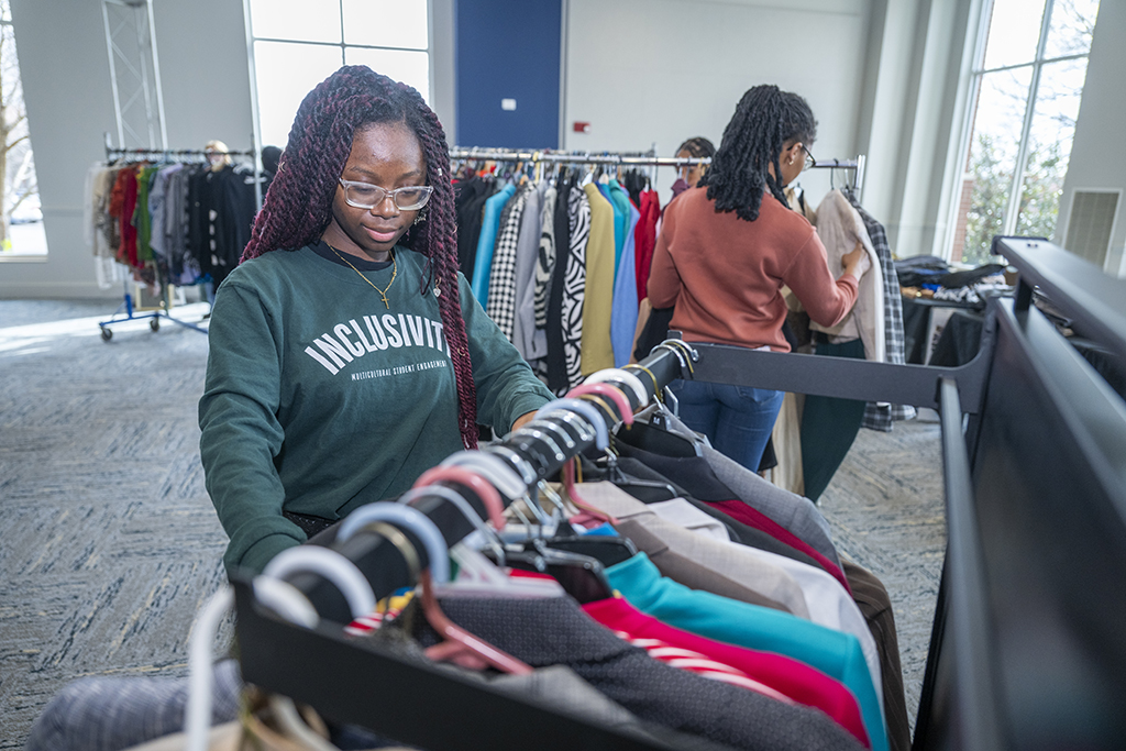 Women looking through racks of clothes