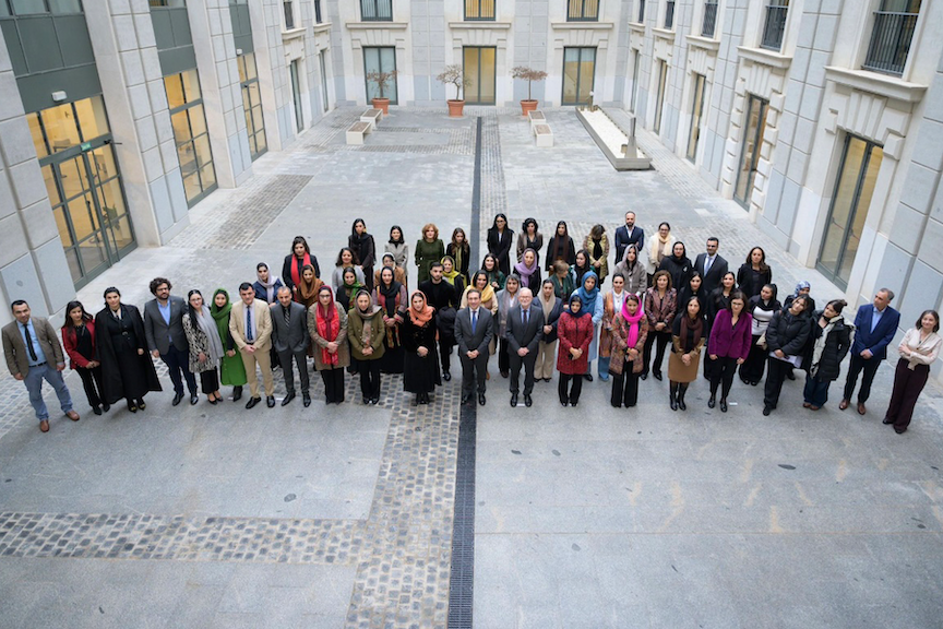 A group photo of the presenters outside.