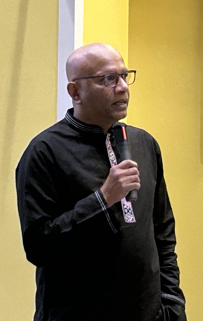 Man talking into a microphone