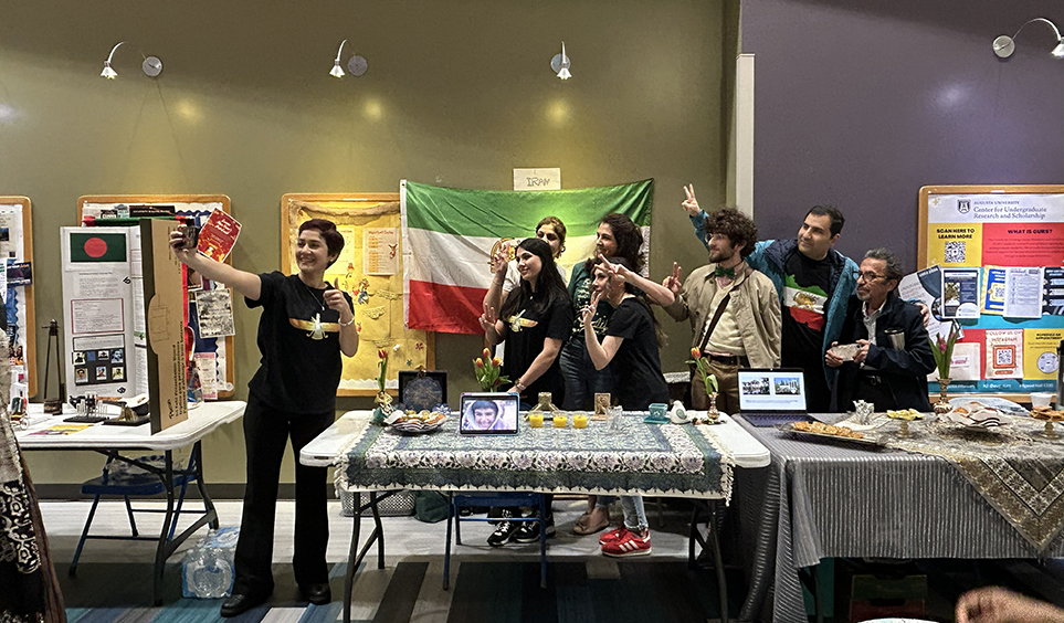 Men and women taking a photo