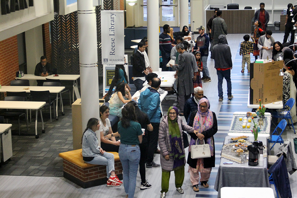 Men and women standing and talking