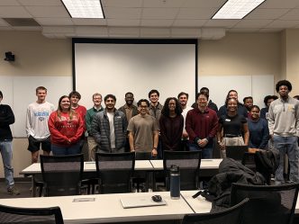 Men and women posing for a photo
