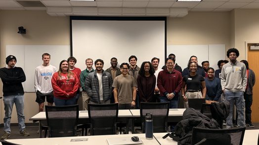 Men and women posing for a photo