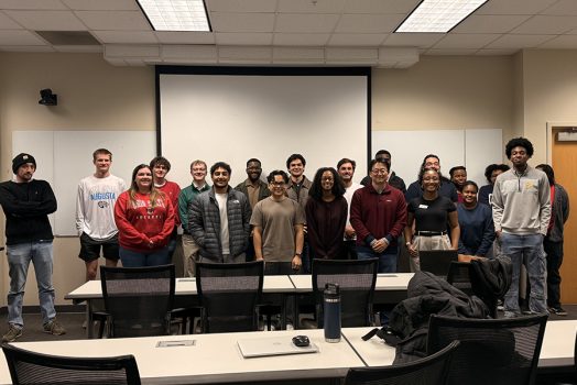 Men and women posing for a photo