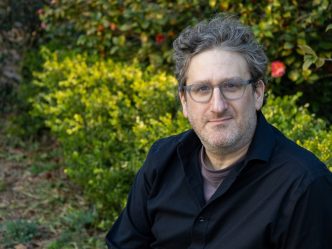 man with glasses smiling