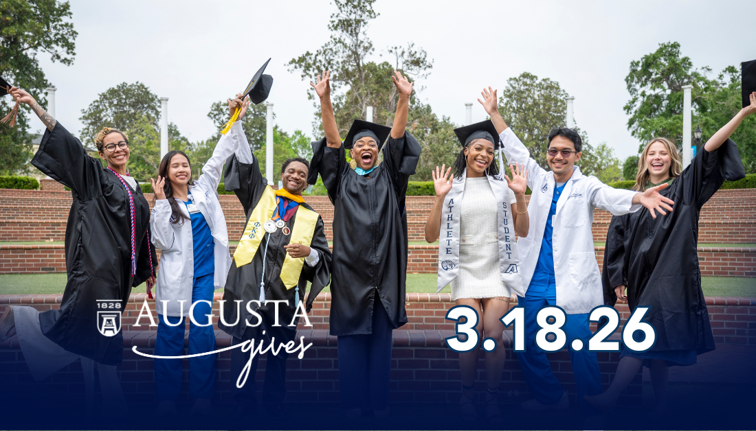 College graduates celebrating outside