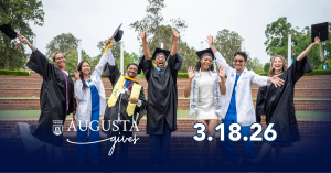 College graduates celebrating outside