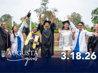 College graduates celebrating outside