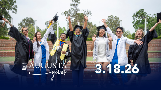 College graduates celebrating outside