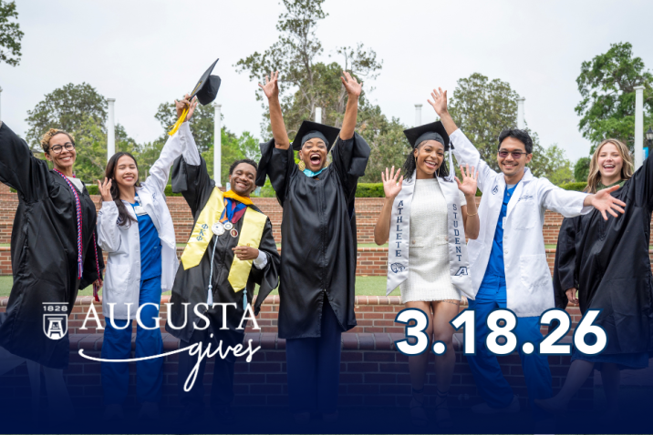 College graduates celebrating outside