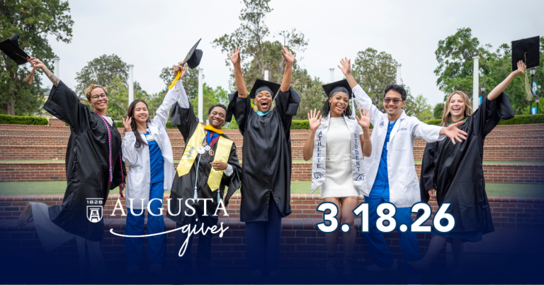 College graduates celebrating outside