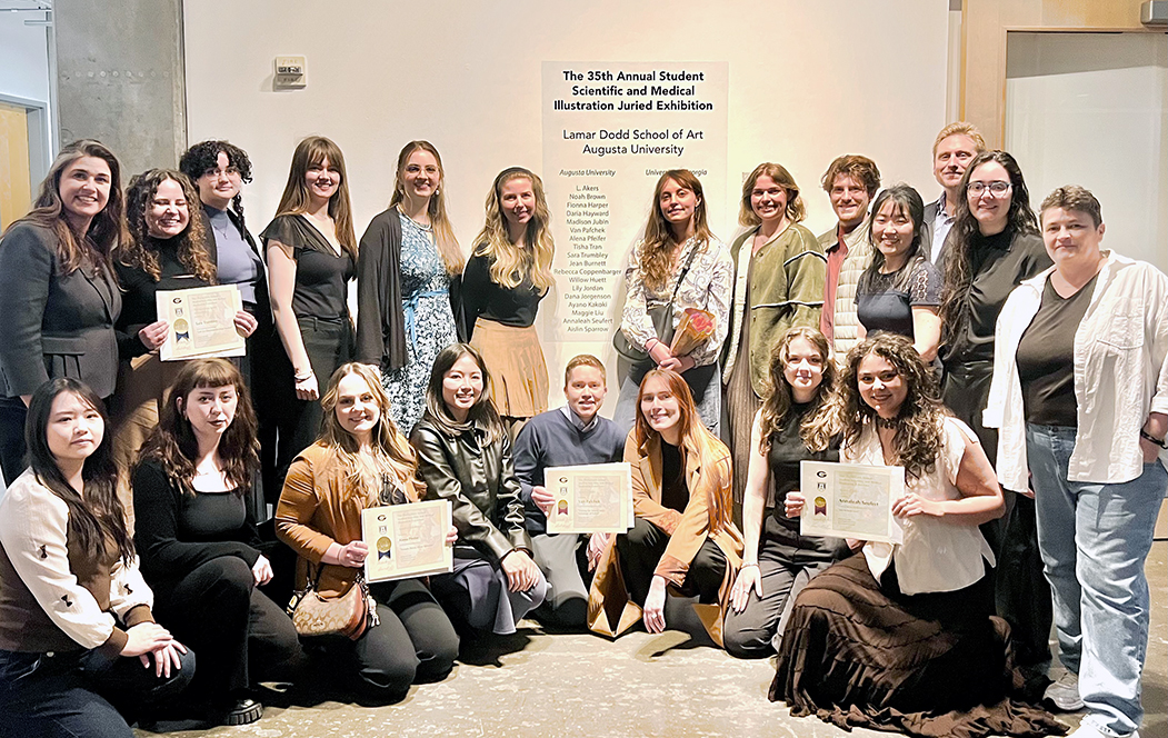 Men and women pose to take a photo