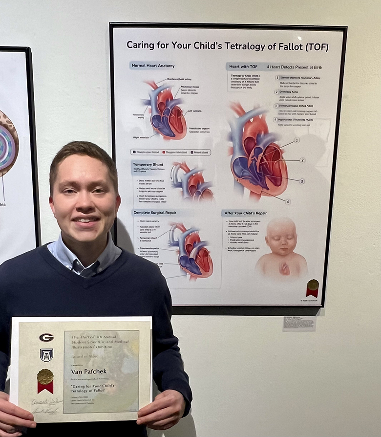 Woman holding a certificate in front of her winning display