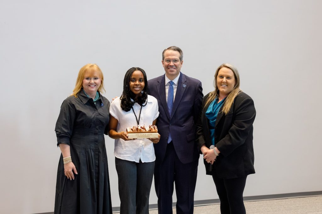 Group holding an award.