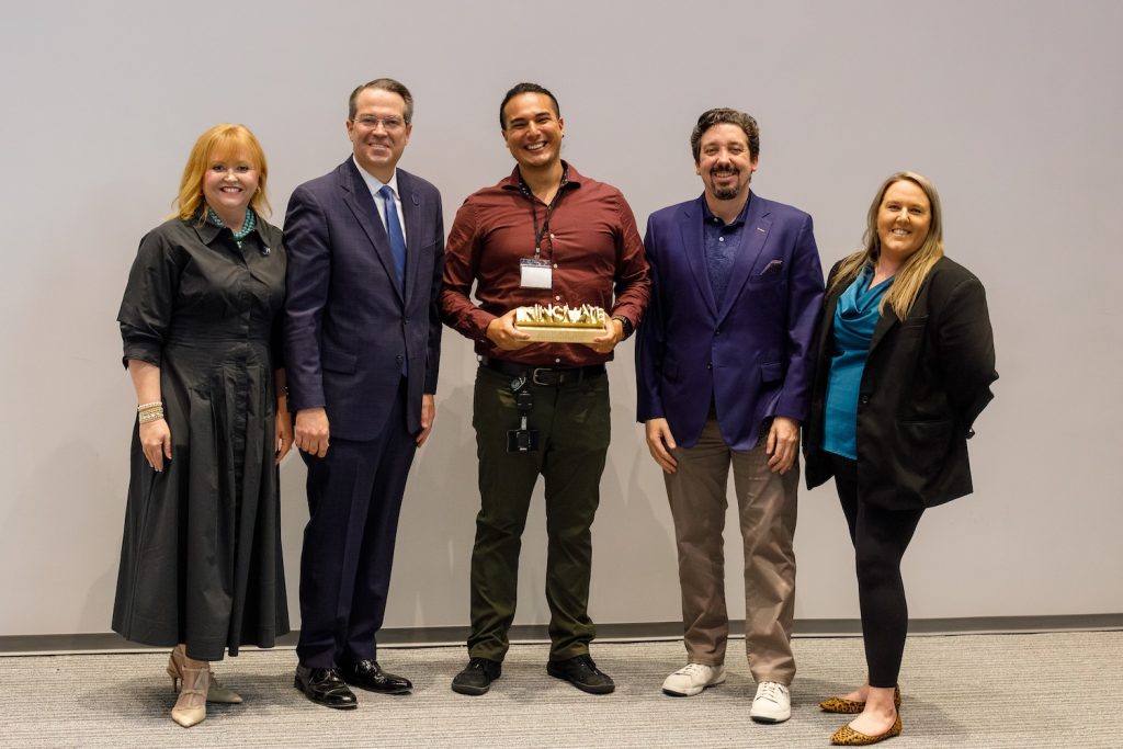 Group of people with an award.