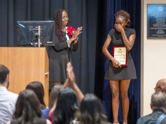 Female student reacts after winning an award